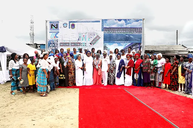 The Special Guest of Honour, Mrs Margret Koshoni, Chief of the Naval Staff, immediate past President of NOWA, past NAFOWA National President, past NAOWA representative and Past NOWA National Presidents in a group photograph with some of the immediate beneficiaries (market women) during the Foundation Laying Ceremony