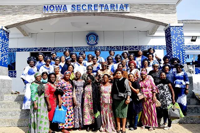 NOWA Abuja Zonal Director, Mrs Loveleen Lassa and other NOWA members in a group photograph with some widows of deceased Naval Personnel during NOWA A-day out with Widows and Orphans programme in Abuja