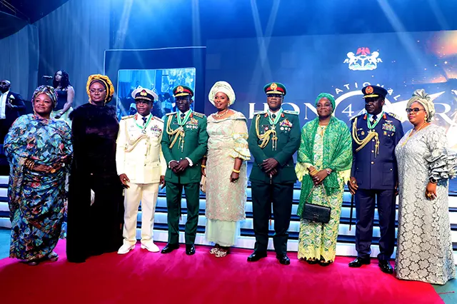 The Immediate Past Chief of Defence Staff, Past Service Chiefs and their spouses in a group photograph during the ceremony of the national honour awards in Presidential Villa, Abuja