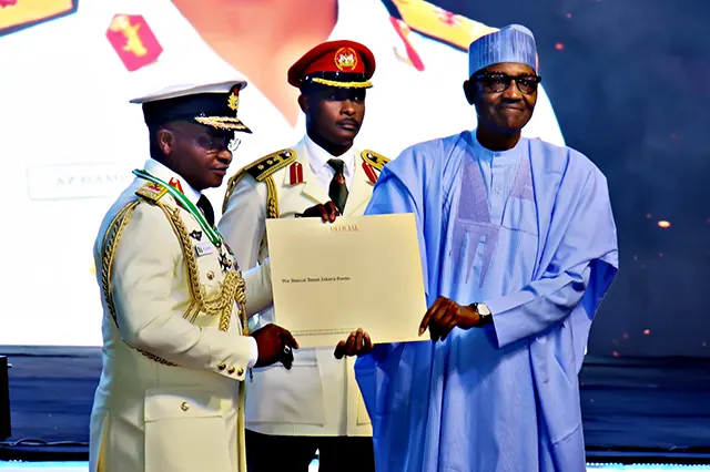 His Excellency, Former President Muhammadu Buhari GCFR presenting the certificate of confirmation for the award of the Commander of the Order of Federal Republic [CFR] to the Immediate Past Chief of the Naval Staff, Vice Admiral AZ Gambo